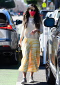 Jordana Brewster treats her dog with a new toy while out for some shopping in Brentwood, California