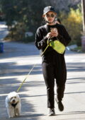 Lucy Hale keeps things casual in black sweatsuit as she takes a walk with her pup Elvis in Los Angeles