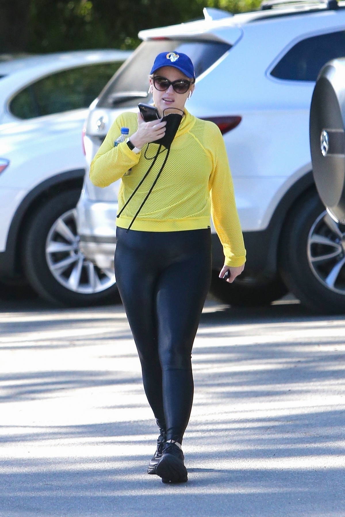 Rebel Wilson stands out in bright yellow hoodie and black leggings while  out for hike in