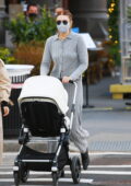 Gigi Hadid looks cozy in a grey knit outfit as she steps out for lunch with a friend and her baby Khai in New York City