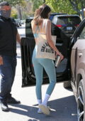 Kendall Jenner shows off her taut figure in teal crop top and leggings  while attending a