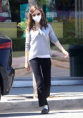 Lily Collins stops to pick up dog food before dropping off her dog in West Hollywood, California