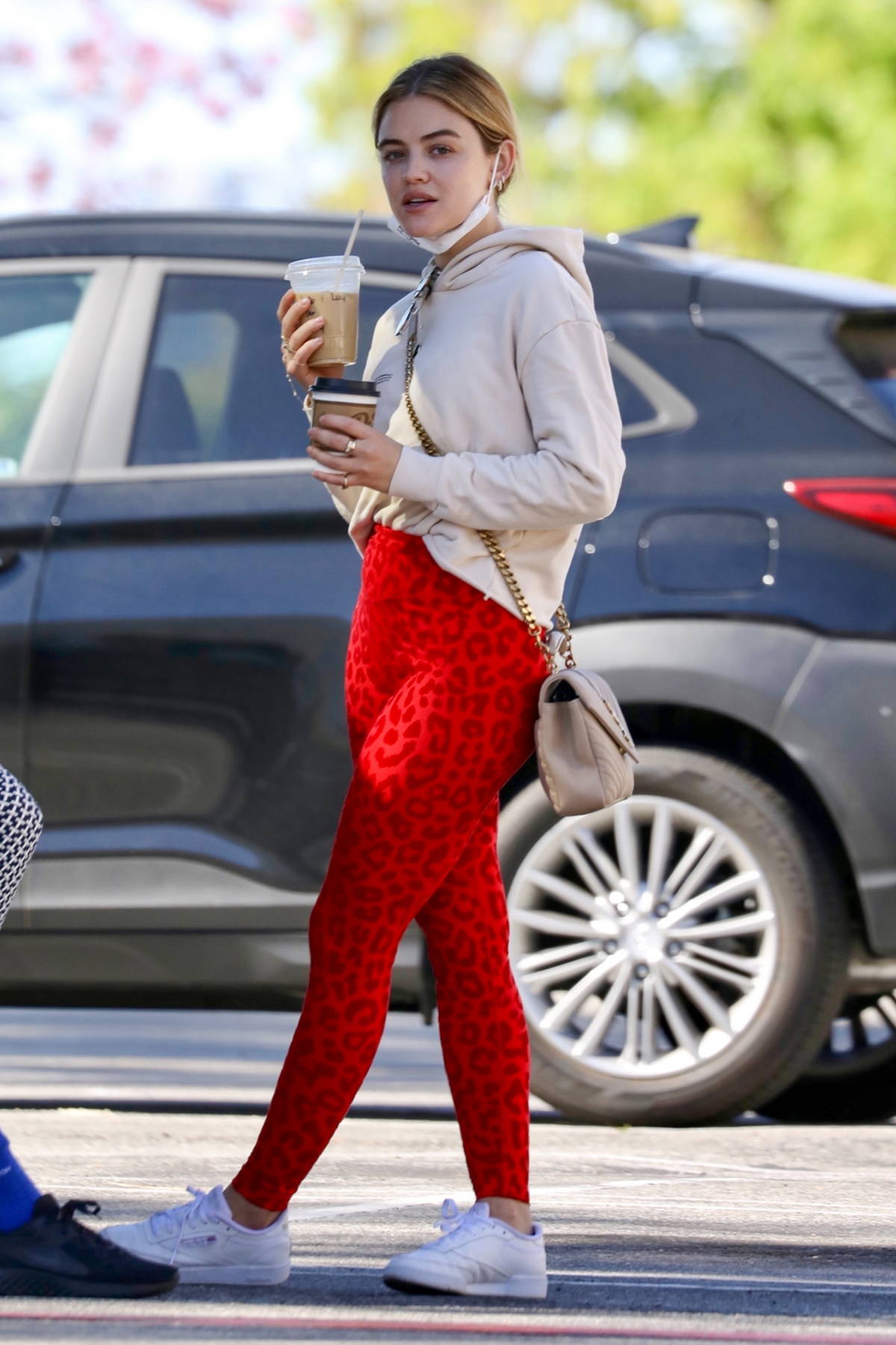 Lucy Hale sports a patterned top and black leggings as she leaves a Pilates  class and