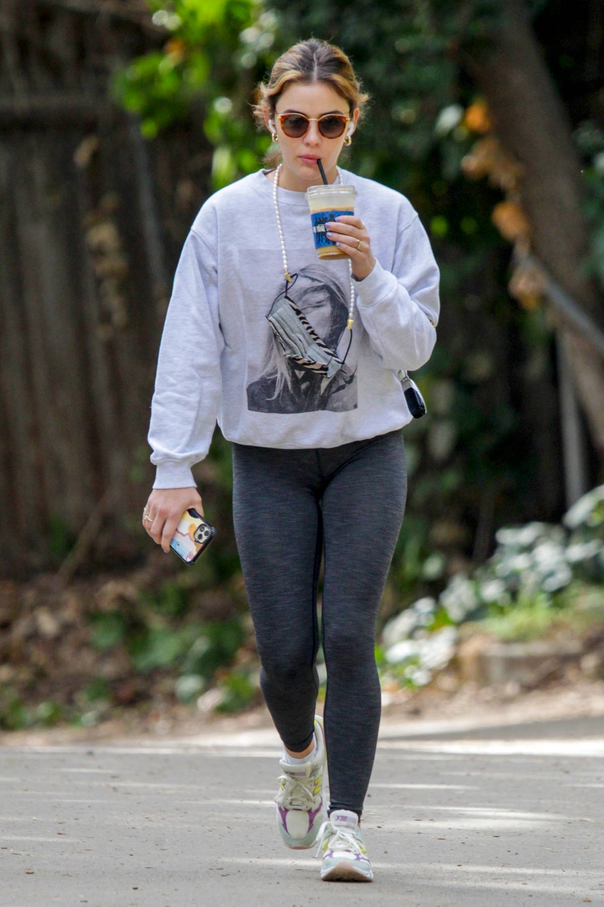 https://www.celebsfirst.com/wp-content/uploads/2021/03/lucy-hale-wears-sweatshirt-and-dark-grey-leggings-as-she-grabs-a-coffee-and-enjoys-a-solo-hike-in-studio-city-california-080321_22.jpg