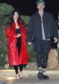 Megan Fox looks stunning a fur-lined red coat during a date night with Machine Gun Kelly at Nobu in Malibu, California