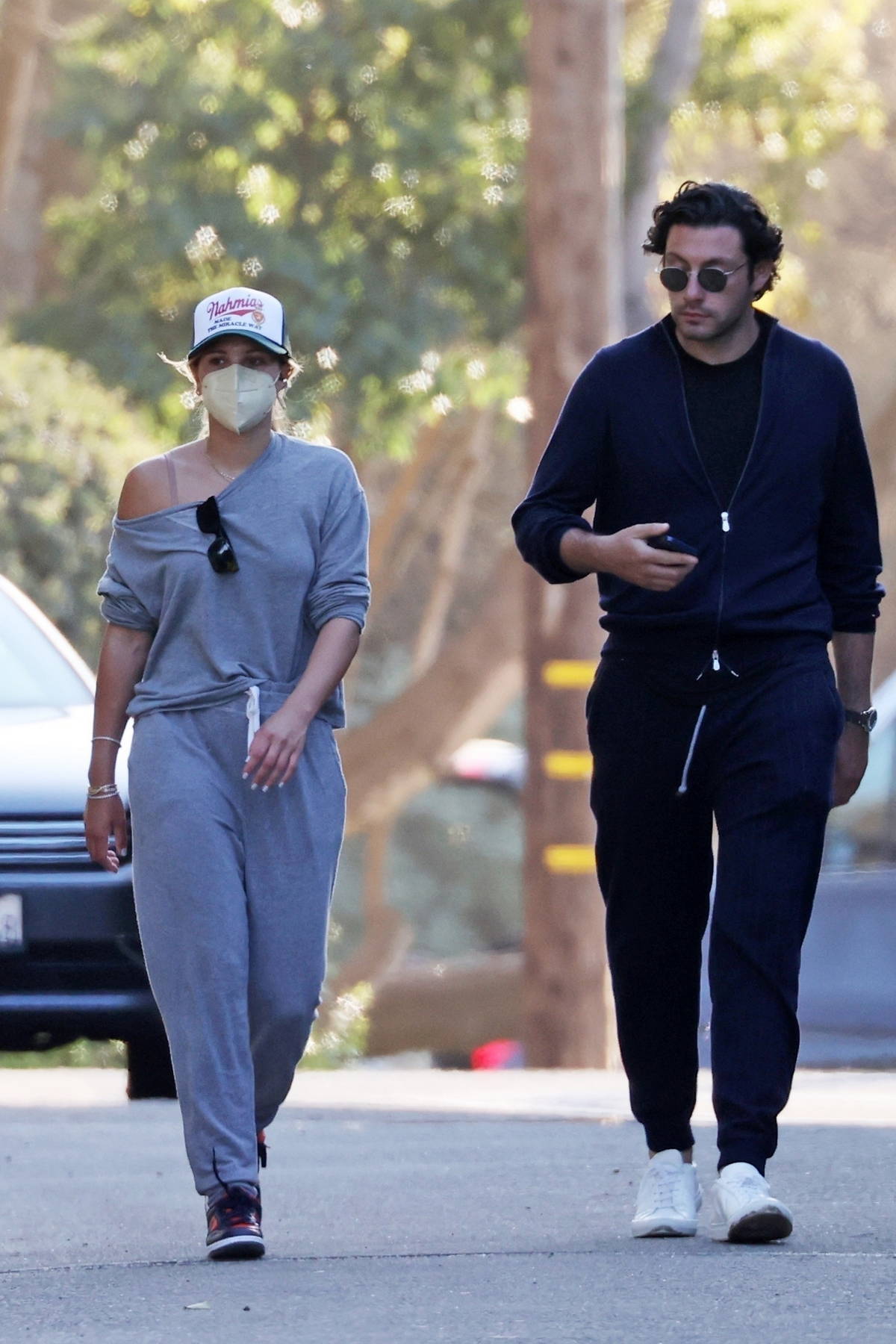 Sofia Richie dresses down in grey sweatsuit while out for an evening stroll  with a mystery