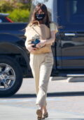 Dakota Johnson picks up some groceries before grabbing herself a coffee while out in Malibu, California