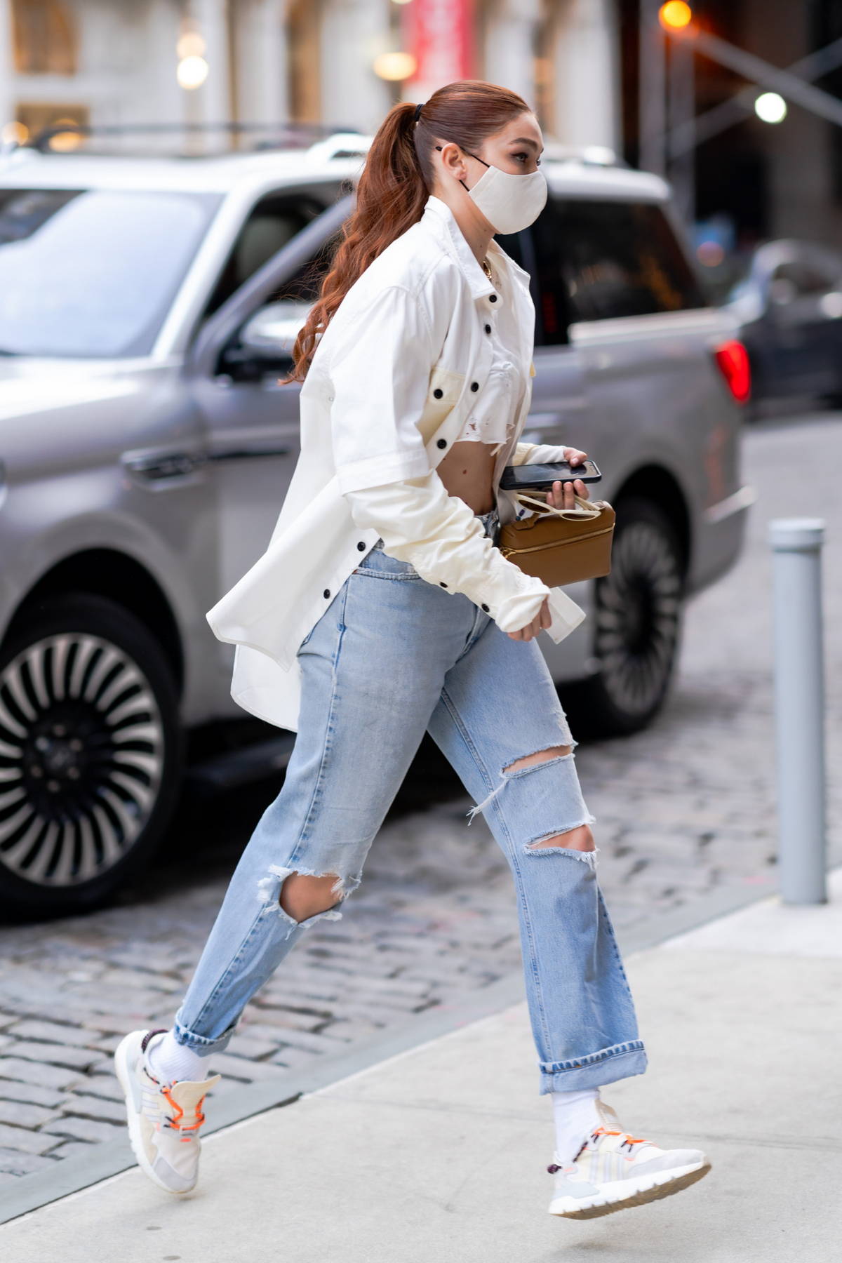 Gigi Hadid seen wearing blue jeans and a white tee shirt in New York City -  Linda Gaunt Communications