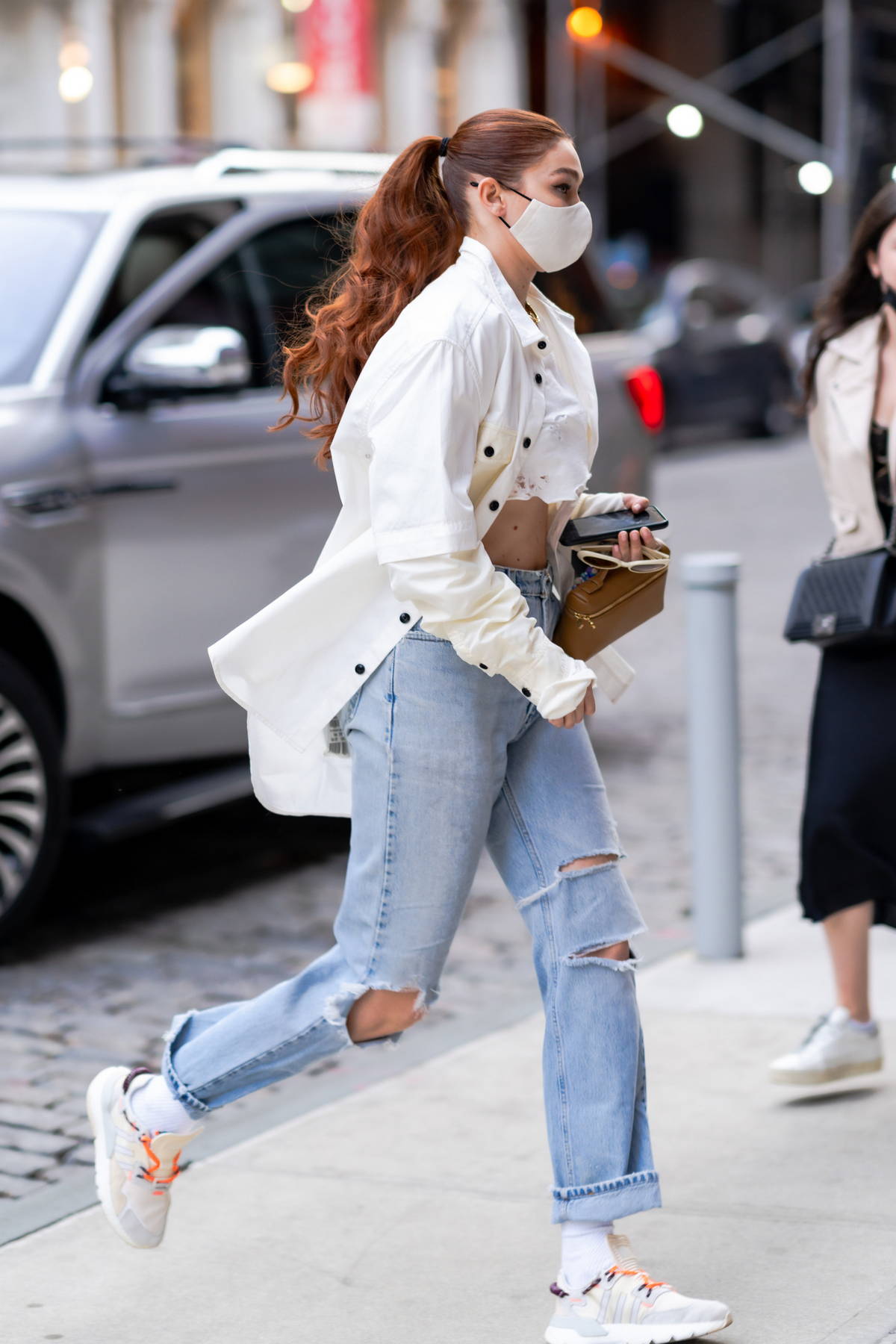 Gigi Hadid Nails High-Low Fashion by Pairing Ripped Jeans With the Perfect  Travel Bag
