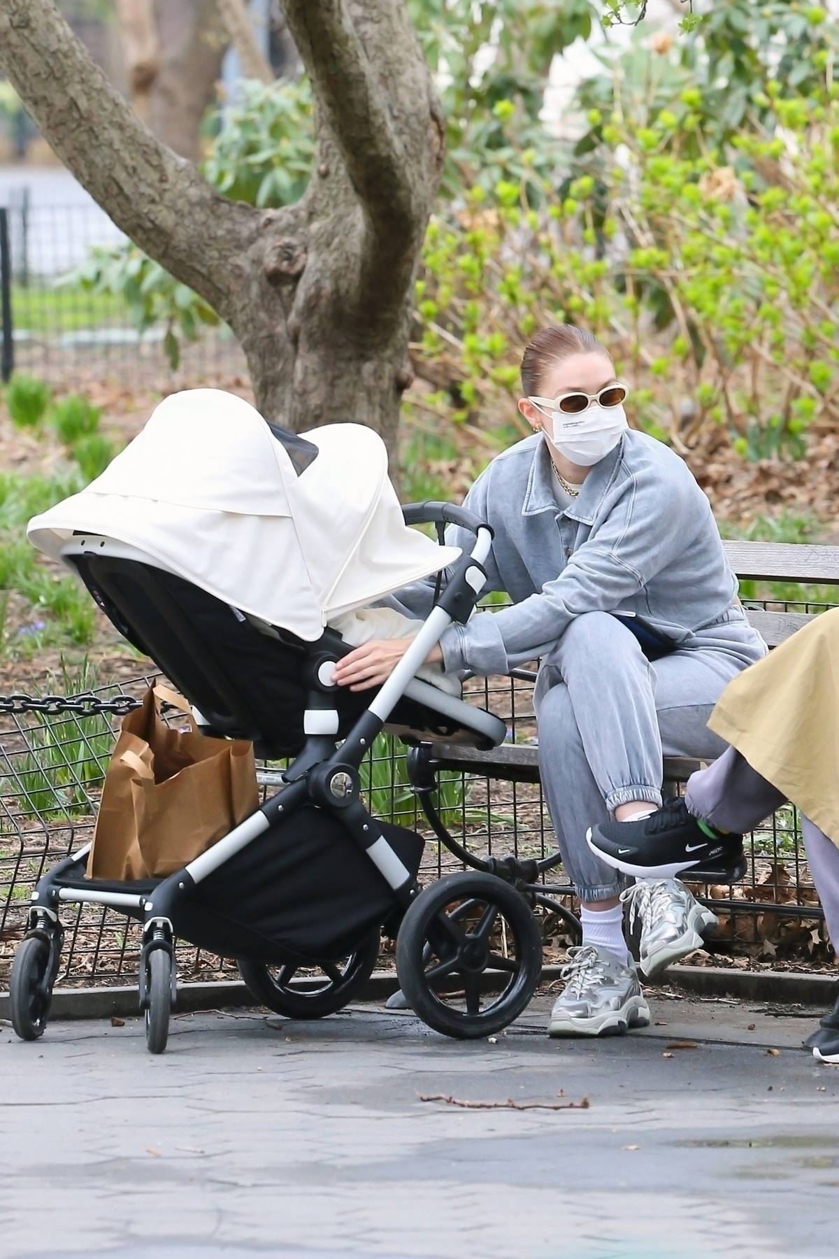 Gigi Hadid stays cozy in grey sweats as takes a her baby out for a stroll