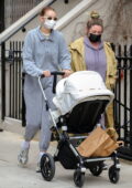 Gigi Hadid stays cozy in grey sweats as takes a her baby out for a stroll to the Washington Square Park in New York City