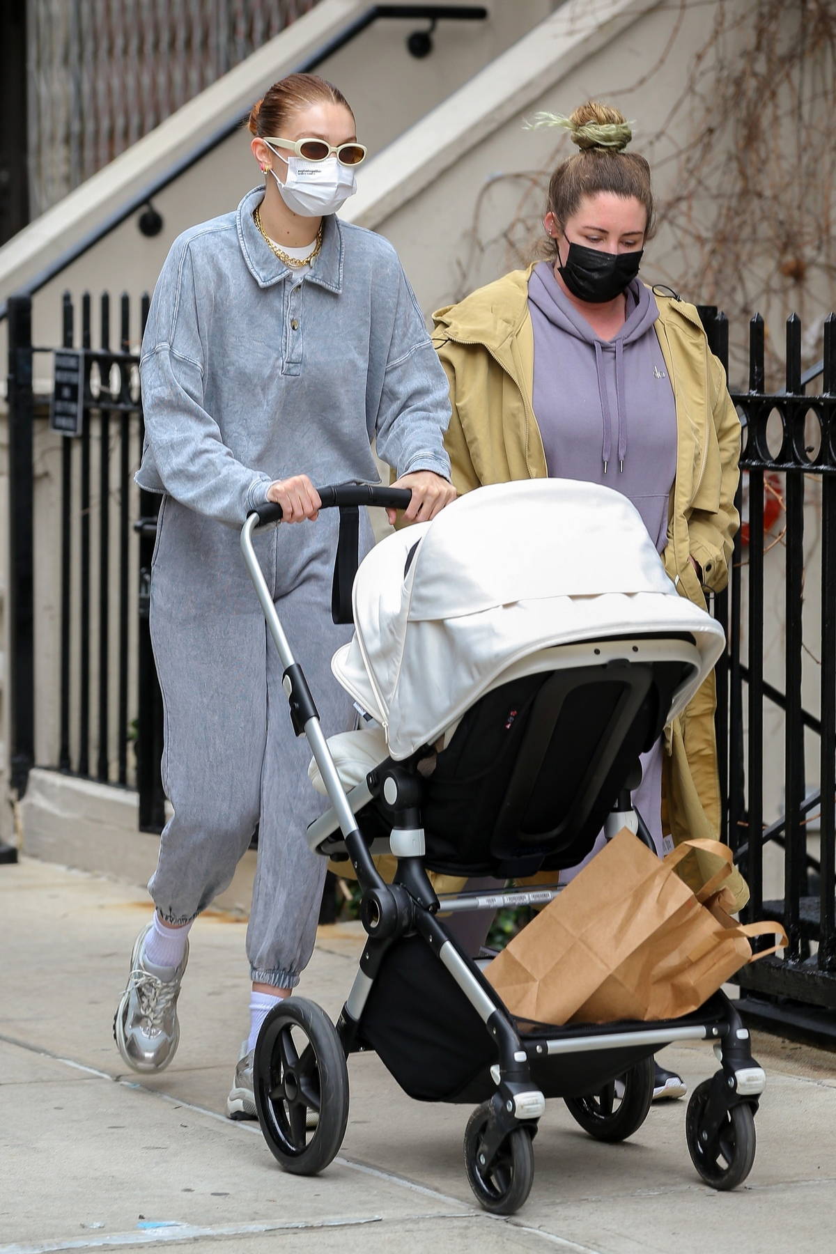 Gigi Hadid stays cozy in grey sweats as takes a her baby out for a stroll
