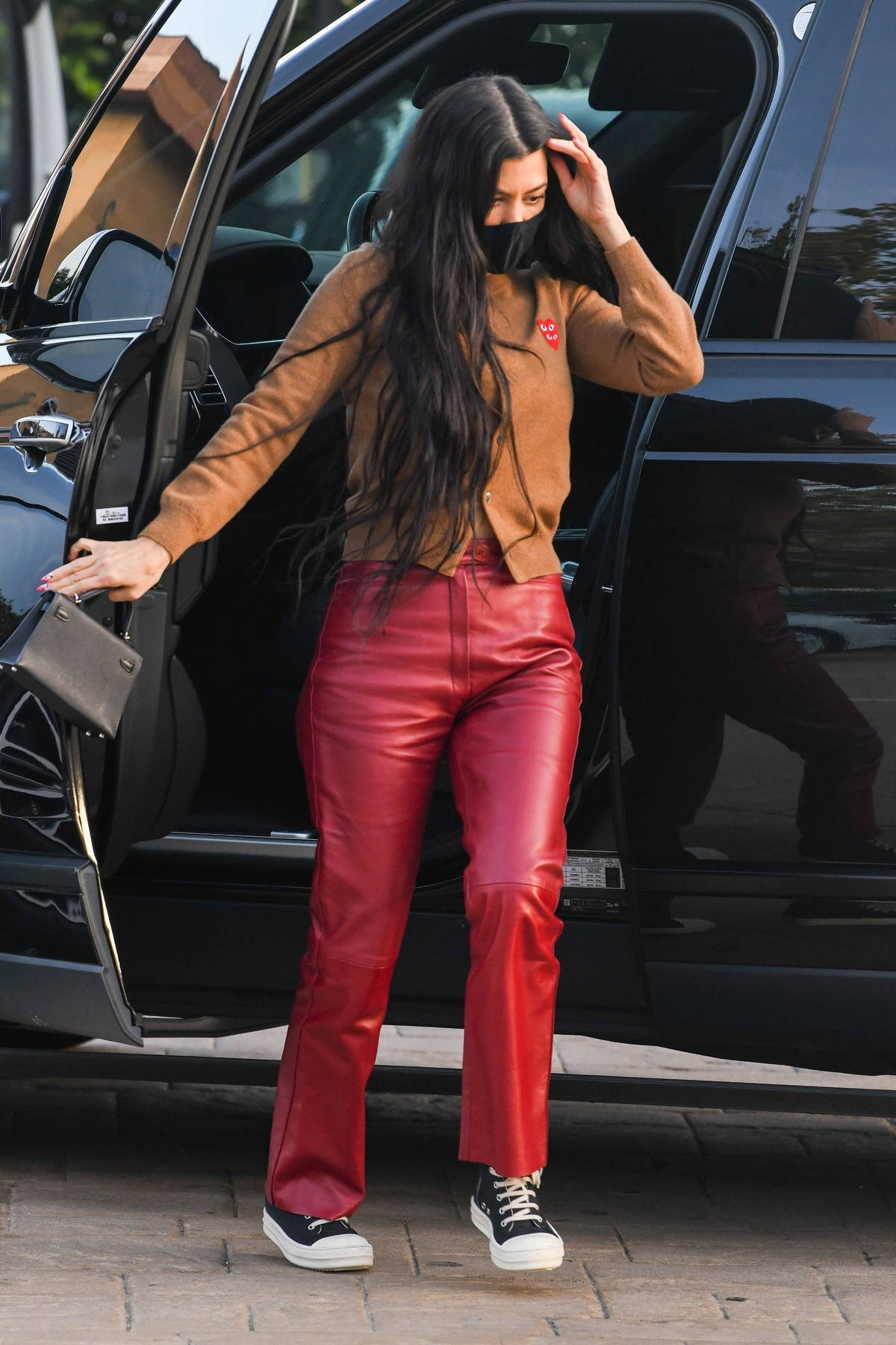 Kourtney Kardashian steps out wearing red leather pants as she grabs dinner  with friends at Nobu