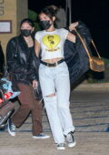 Madison Beer wears a cropped white tee and jeans for a dinner outing at Nobu in Malibu, California