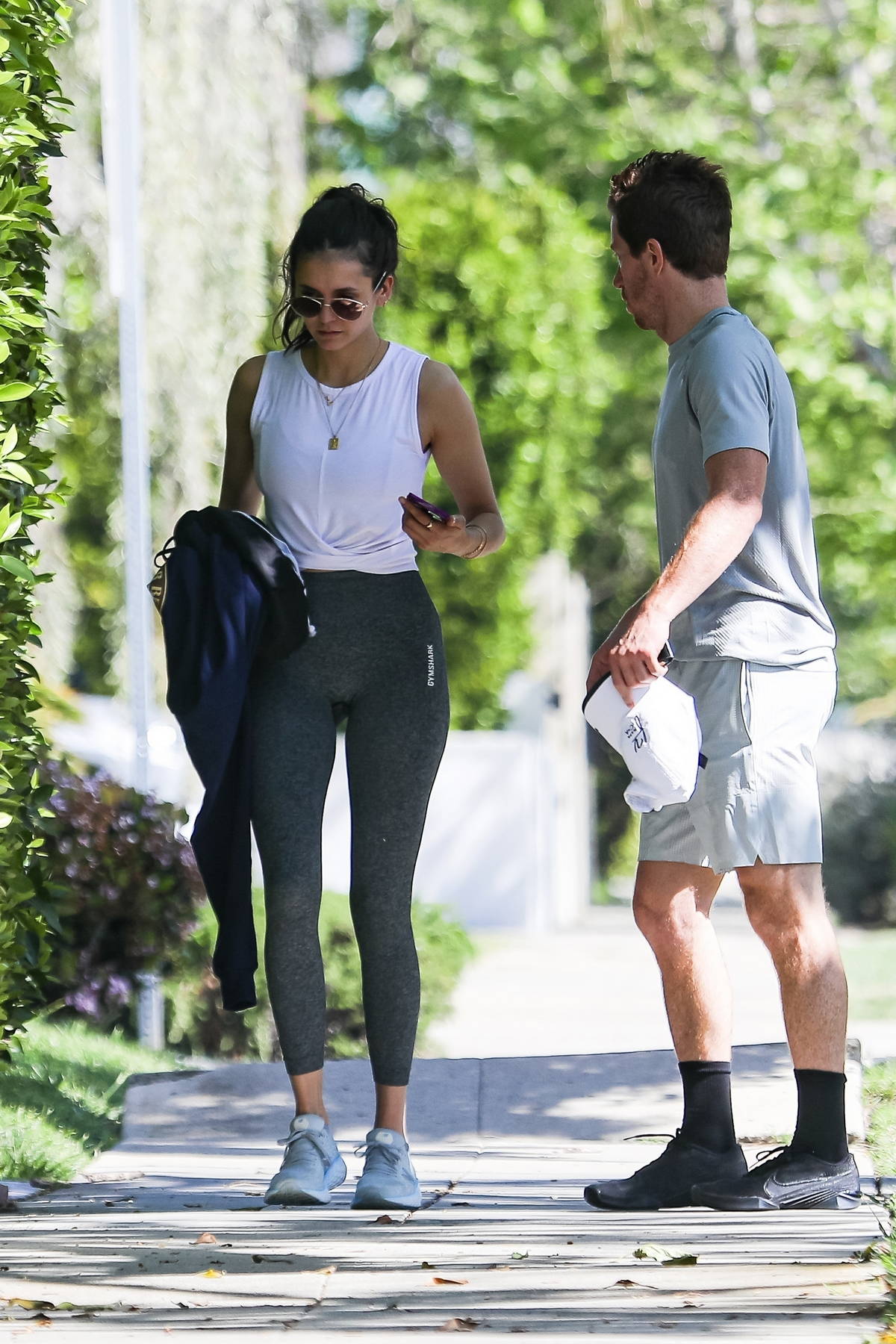 https://www.celebsfirst.com/wp-content/uploads/2021/04/nina-dobrev-looks-sporty-in-tank-top-and-leggings-while-heading-for-workout-with-shaun-white-in-los-angeles-190421_11.jpg