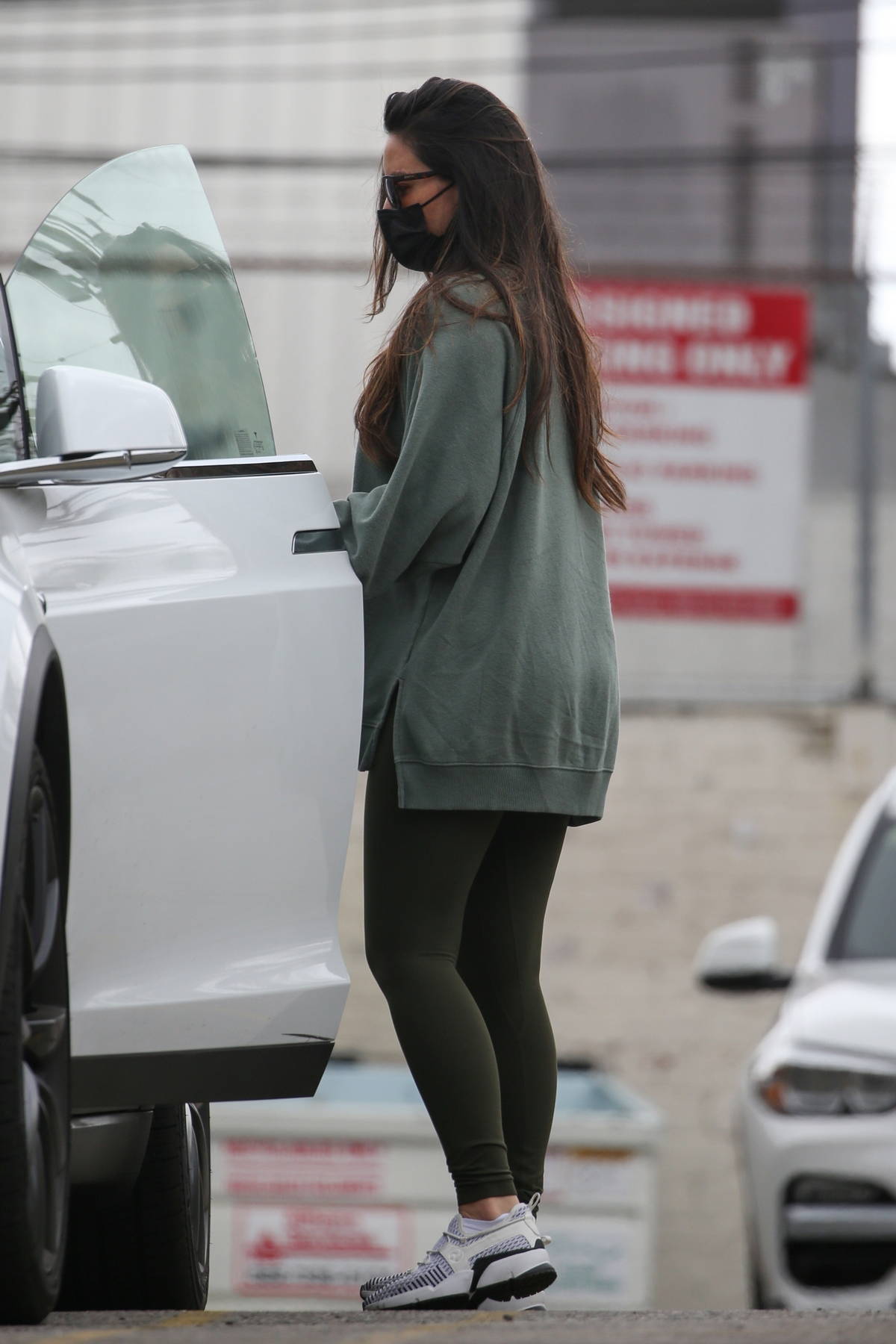 Olivia Munn seen leaving the gym wearing an oversized sweatshirt