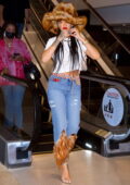 Rihanna looks stylish in a fur hat with matching feathered jeans while shopping at book store in Los Angeles