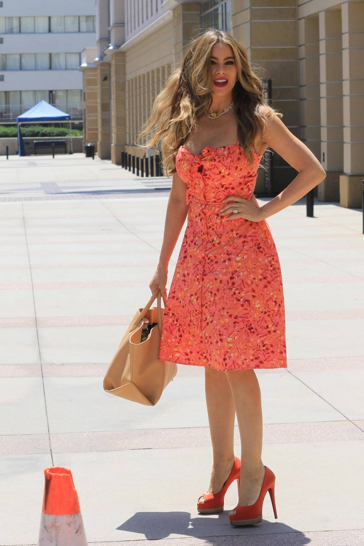 Sofia Vergara looks great in a floral print orange dress while arriving at  America's Got Talent