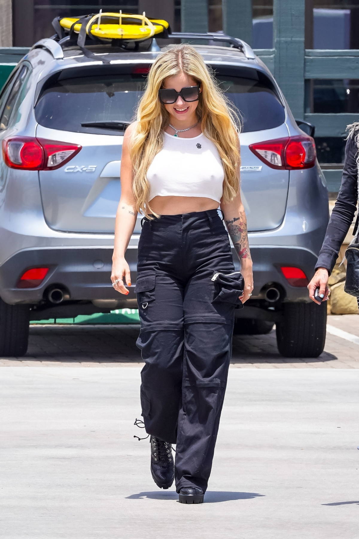avril lavigne is all smiles as she steps out wearing a white crop top and black  cargo pants in malibu, california-270521_6