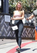 Sydney Sweeney looks casual yet trendy in a personalized tee with flared  blue denim while leaving