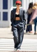 Emily Ratajkowski flashes her flat abs in a crop top with an oversized grey suit while out for stroll in New York City