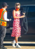 Hailey Bieber looks pretty in a red floral print dress as she arrives for dinner at Nobu in Malibu, California