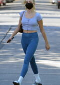 Maddie Ziegler displays toned figure in a crop top and leggings as