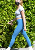 Maddie Ziegler displays toned figure in a crop top and leggings as