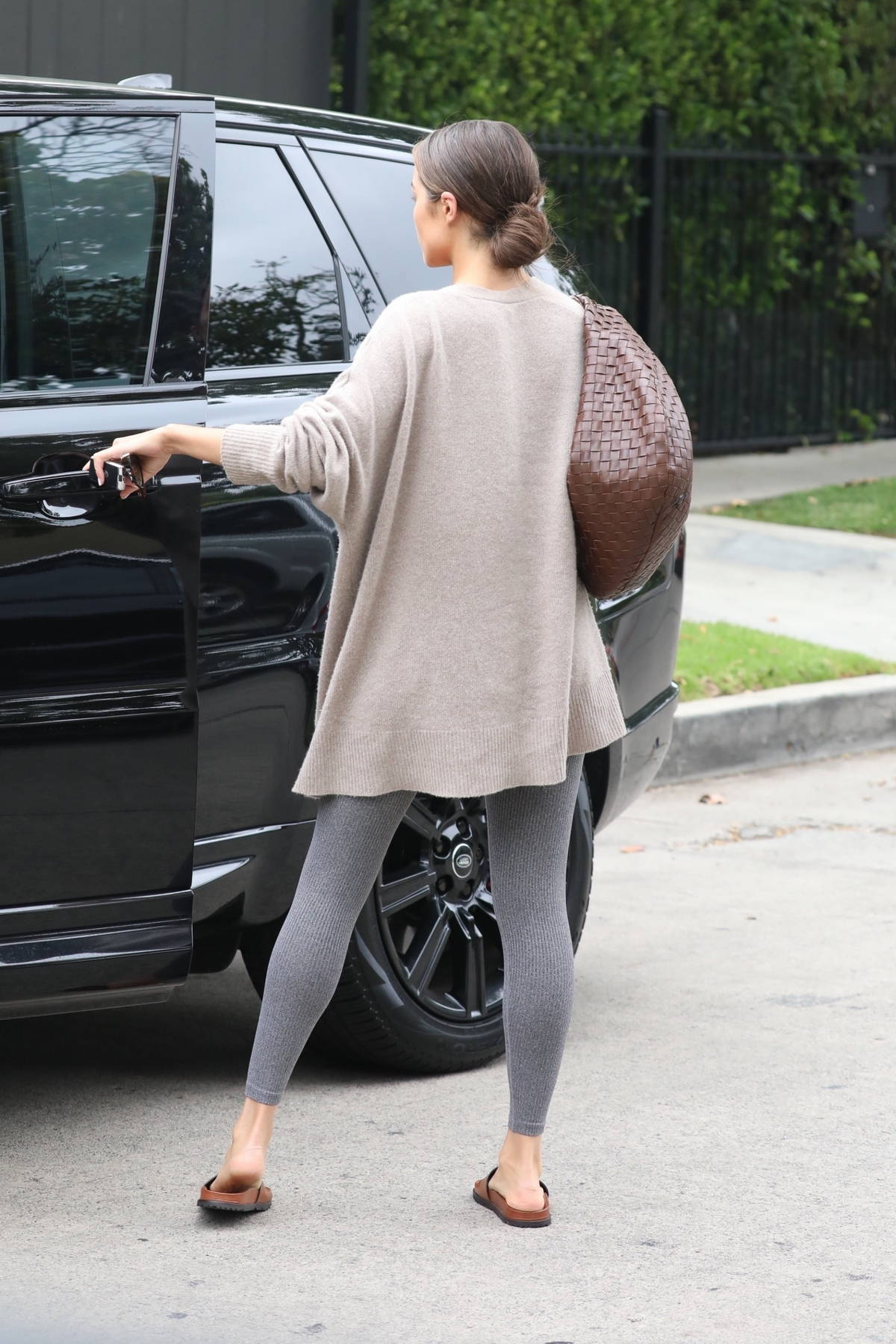 Olivia Culpo looks fantastic in a grey workout top and leggings as