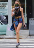 Candice Swanepoel shows off her super-model frame in a crop top and patterned short shorts as she steps out in New York City