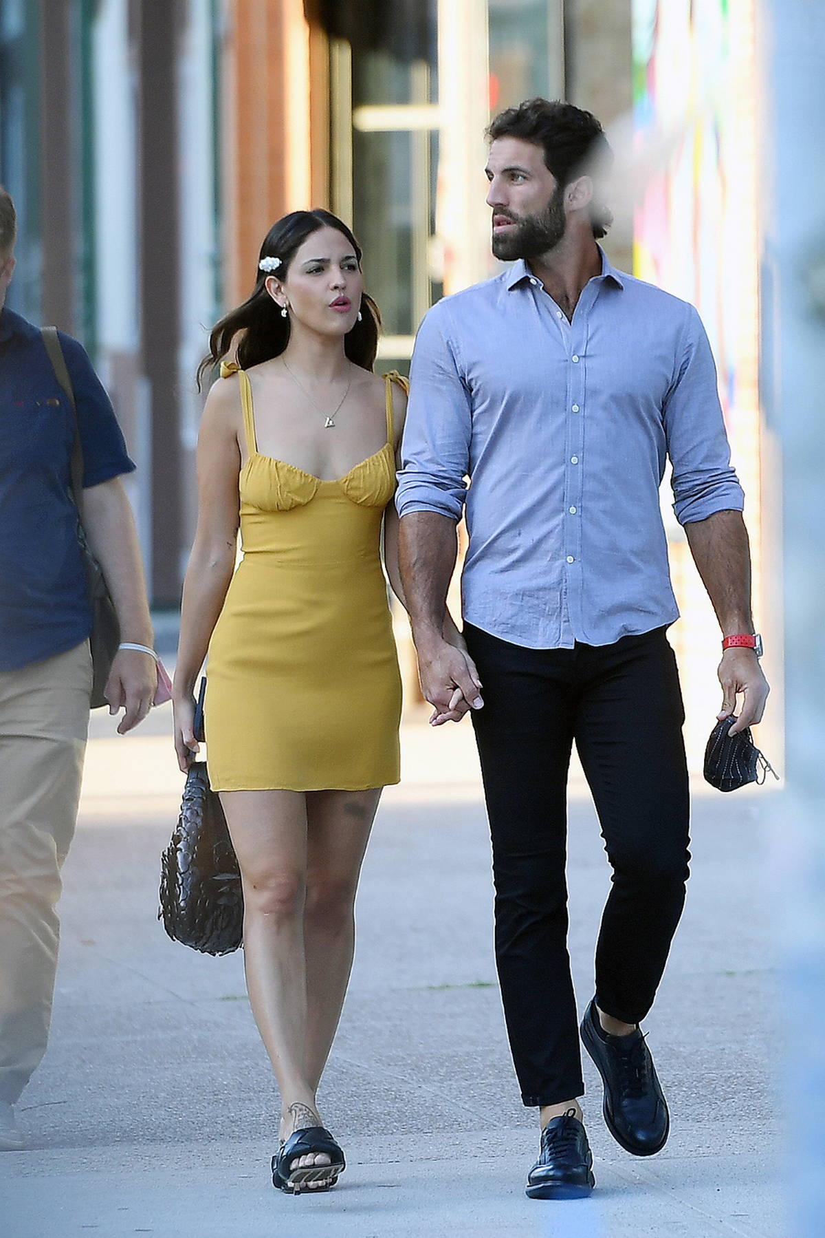 Eiza Gonzalez looks cute in a yellow mini dress while stepping