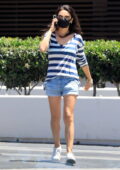 Mila Kunis keeps it casual in a striped top and denim shorts while out in Beverly Hills, California
