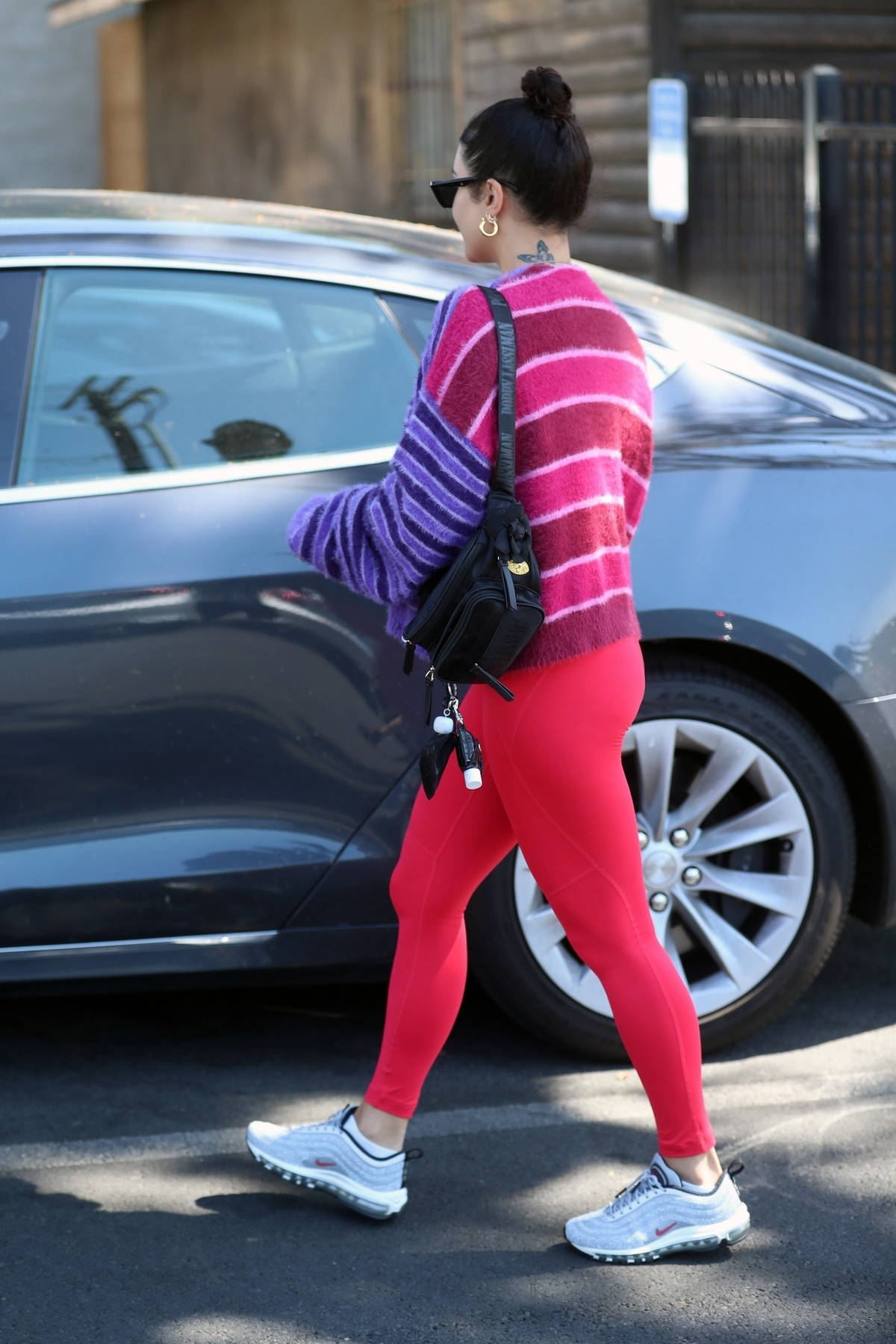 vanessa hudgens stands out in bright red workout top and leggings