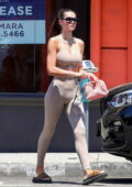 Amelia Hamlin shows off her toned figure in beige workout top and leggings while leaving the gym in West Hollywood, California