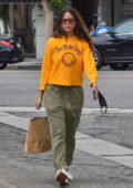 Eiza Gonzalez stands out in bright yellow sweatshirt while she picks up lunch at Joan's on Third in Los Angeles