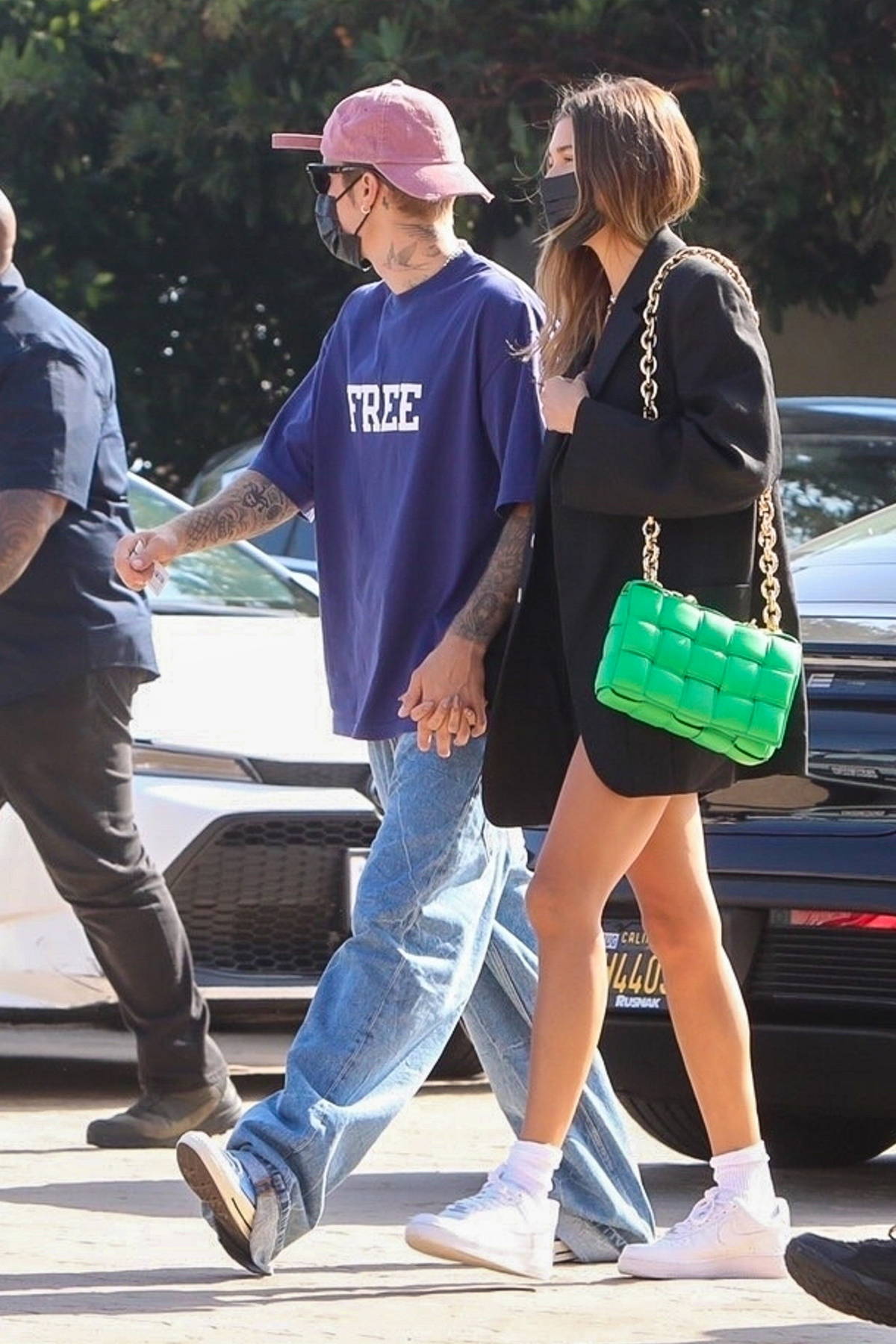 Justin Bieber holds his pants at lunch while Hailey Bieber rocks black