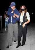 Kaia Gerber and Jacob Elordi hold onto each other while leaving their dinner date at Matsuhisa in Beverly Hills, California