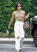 Lucy Hale dons a form-fitting tank top and distressed denim while stopping by her stylists' office in Beverly Hills, California