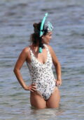 Rachel Bilson hits Hawaii in plunging one-piece swimsuit