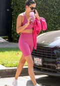 Sara Sampaio rocks a hot pink sports bra and legging shorts for