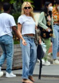 Sienna Miller goes casual in a white tee and blue jeans while stepping out in New York City