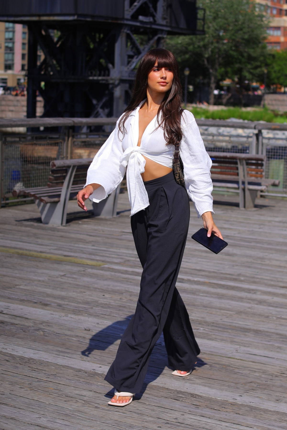 tao wickrath looks trendy in a knotted white blouse and black trousers as  she steps out in new york city-060821_1
