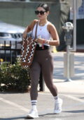 Alessandra Ambrosio keeps it sporty in beige workout top and