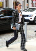 Bella Hadid looks stylish in a white top paired with a plaid suit while stepping out in New York City
