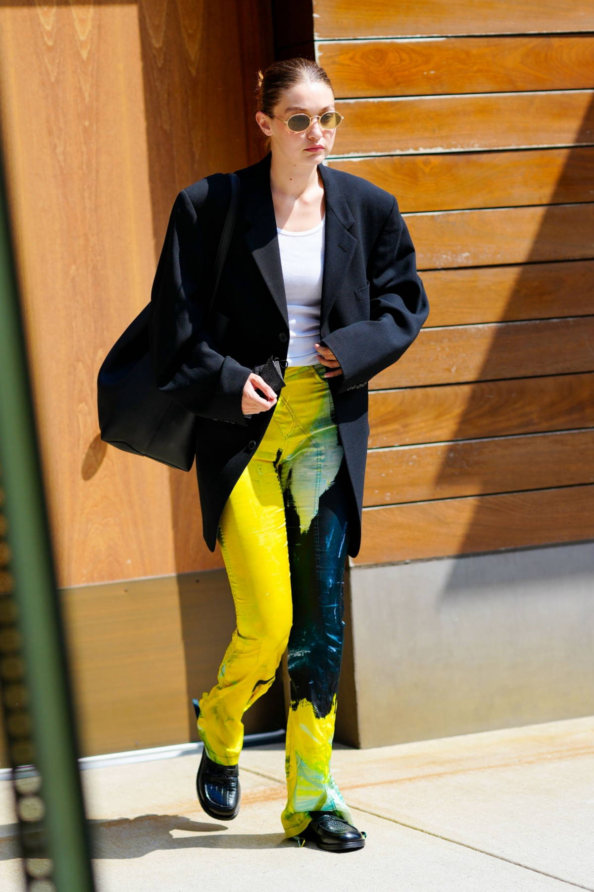 gigi hadid looks trendy in bright yellow pants and black blazer while  heading out in new york city-080921_9