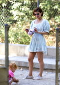 Kate Mara looks cute in a short summer dress as she takes her daughter to the park in Los Feliz, California