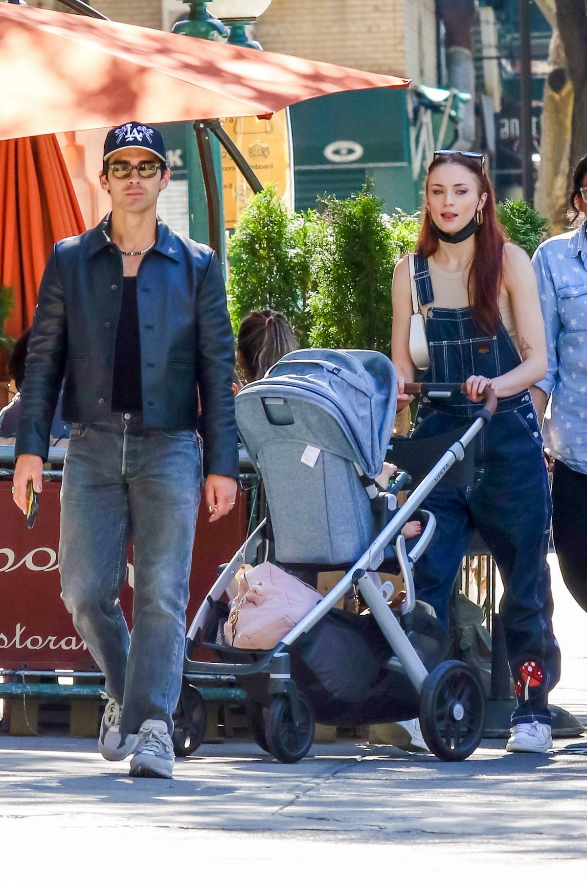 Sophie Turner rocks 70s chic trousers as she and Joe Jonas take baby Willa  out in her stroller