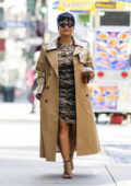 Demi Lovato rocks a tan trench coat over a patterned dress while out for an iced beverage at Le Pain Quotidien in New York City