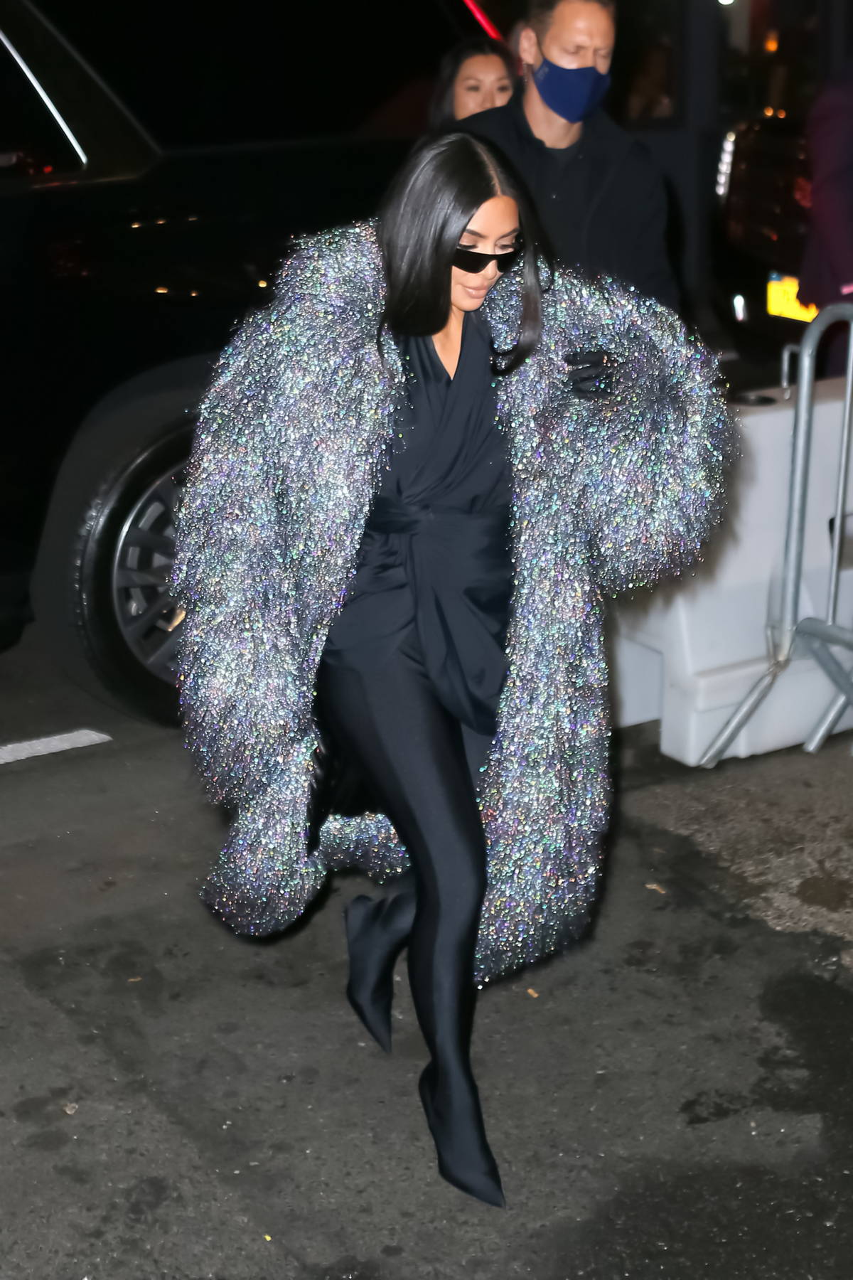 kim kardashian dazzles in a metallic fur coat over her all-black ...