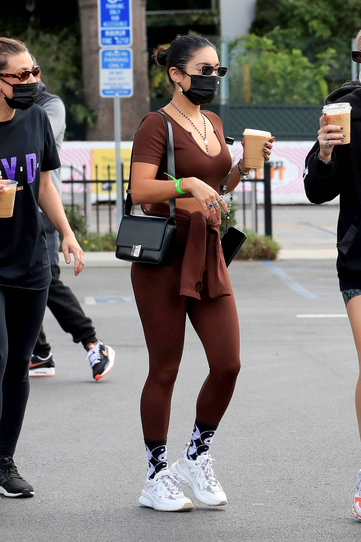 Vanessa Hudgens shows off her toned body in brown leggings and